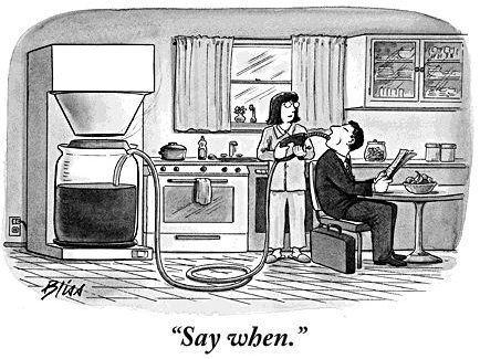 A latte with heart latte art on a wooden table